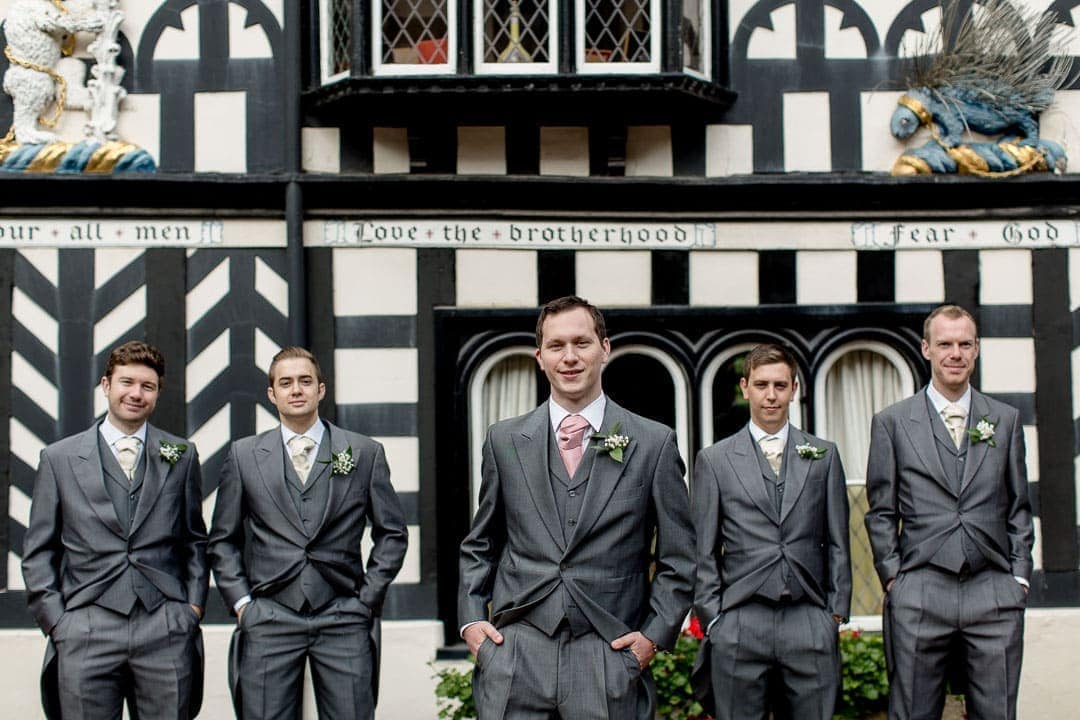 Groom and groomsmen outside Lord Leicester wedding venue in Warwickshire